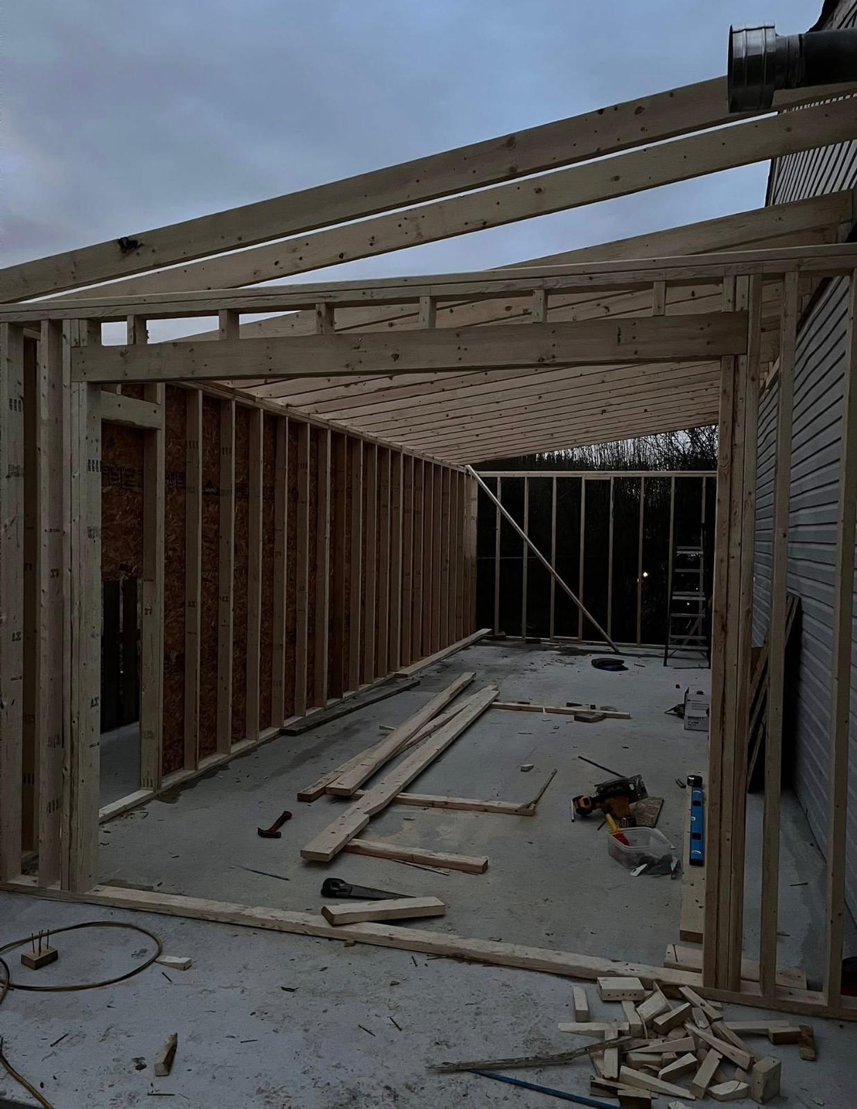 Large outdoor structure framing at dusk by Leeonitis Contracting London Ontario