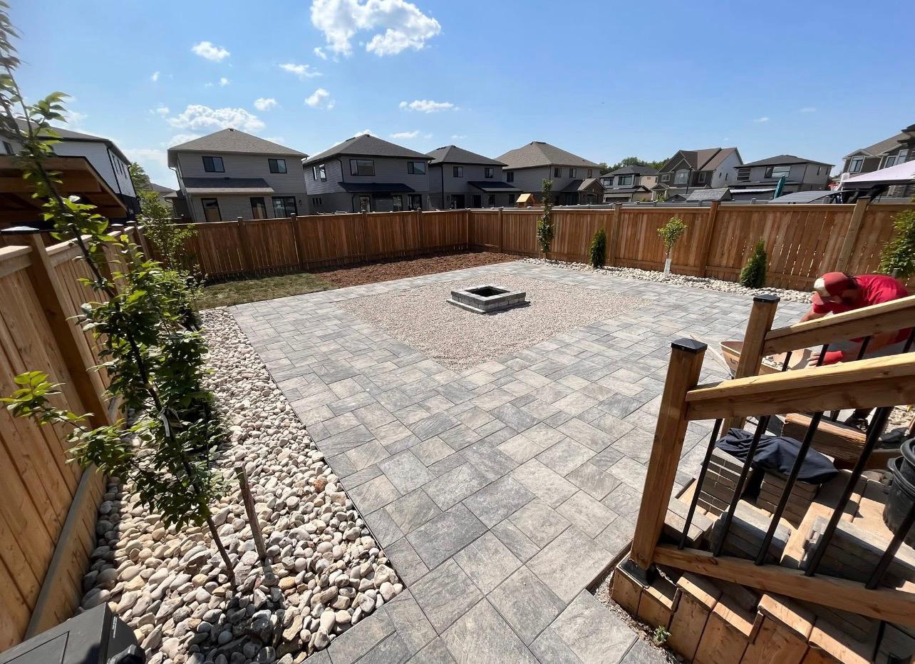 Paver patio and fire pit by Leeonitis