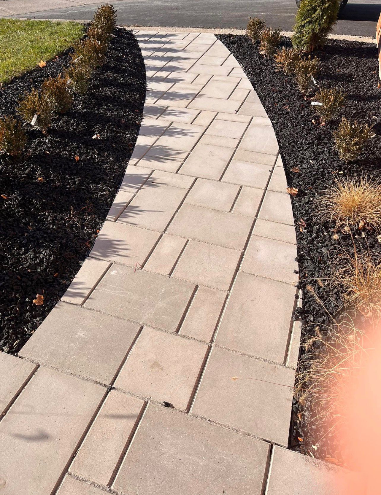 Curved paver walkway by Leeonitis